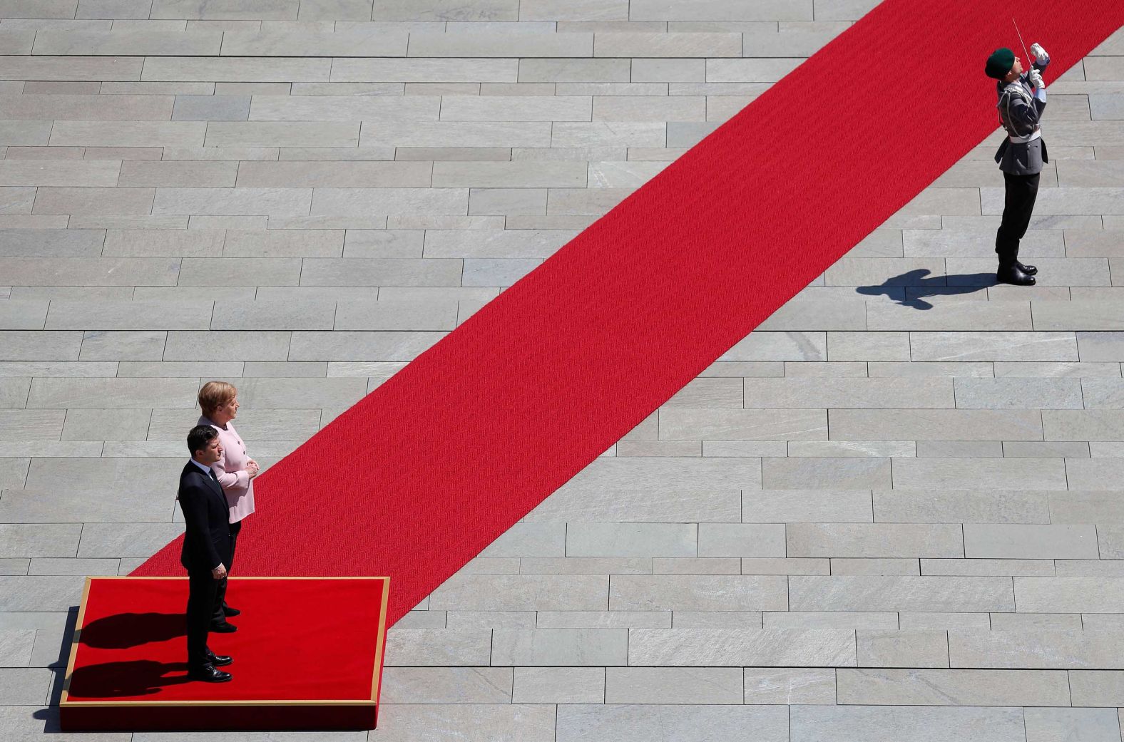 Merkel and new Ukrainian President Volodymyr Zelensky inspect a military honor guard as he arrives for his first official visit to Germany in June 2019. Merkel <a href="https://edition.cnn.com/2019/06/18/europe/merkel-shaking-ceremony-intl-scli/index.html" target="_blank">was seen shaking</a> during the ceremony, but she later suggested dehydration was to blame and said that she was doing "very well."