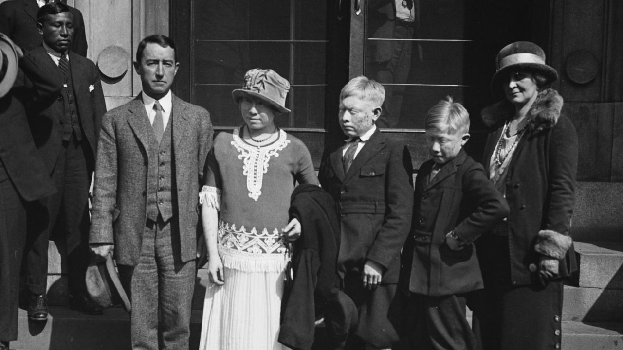 American explorer Richard Marsh poses with three "white Indians" he discovered in Panama and brought with him to Washington in 1924.