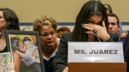 Yazmin Juárez, reacts as a photos of her daughter, Mariee, who died after being released from detention by U.S. Immigration and Customs Enforcement, is placed next to her at a House Oversight subcommittee hearing on Civil Rights and Civil Liberties to discuss treatment of immigrant children at the southern border, Wednesday, July 10, 2019, on Capitol Hill in Washington. (AP Photo/Jacquelyn Martin)