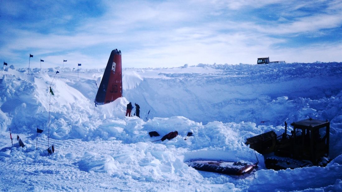 <strong>December 1986: </strong>Jim Mathews, project manager for the recovery operation, shared these photos with CNN Travel. "We had measurement for the plane, but finding other parts took some work," he said. "We measured to where the No. 1 engine should be and with a combination of shovel work and the skilled maneuvering of Roger Biery in the 931, our smallest tractor, we found the blade. Once we had that the wingtip was easy... and so on.  You can see our biggest tractor, an LG (Low Ground Pressure) D-6, pushing snow away from the excavation site in the distance."