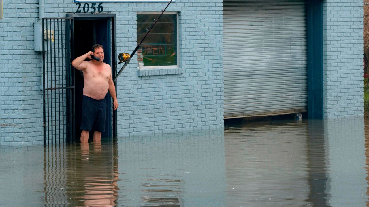 David Fox makes a call on Wednesday, July 10, from his business on Poydras Street in New Orleans.