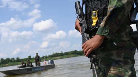 Armed Thai navy personnel in a boat during a patrol along the Mekong river bordering Thailand and Laos on May 23.
