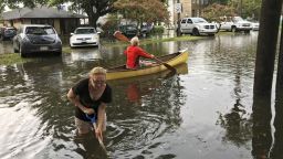 People cope with the aftermath of severe weather in the Broadmoor neighborhood in New Orleans, Wednesday, July 10, 2019.  (Nick Reimann/The Advocate via AP)