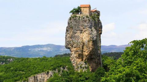This photo taken on Thursday, May 18, 2017 shows the Katskhi pillar, with a monastery on the top, near the village of Katskhi in western Georgian region of Imereti. The Katskhi pillar, formed after tectonic shifts, is a natural limestone monolith of almost 40 metres (130 ft). Monks use a metal ladder for climbing, and cargo is lifted separately using ropes. (AP Photo/Shakh Aivazov)