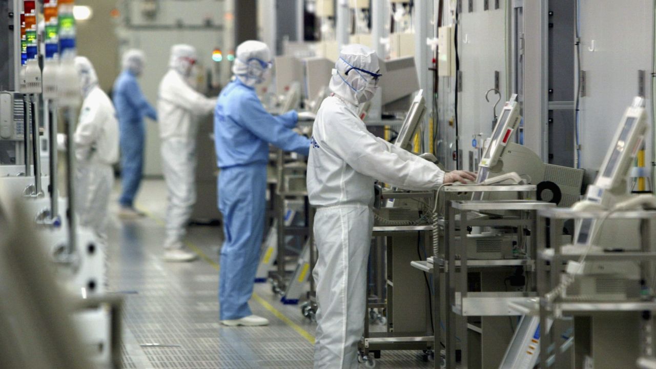 Technicians at work in the clean room of the Fab Equipment at a semiconductor company, Renesas Technology Corp. in Ibaraki, Japan.