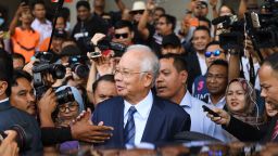 (File photo) Former Malaysia's prime minister Najib Razak greets supporters as he leaves the courthouse in Kuala Lumpur on December 12, 2018.