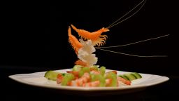 TO GO WITH STORY: CHINA-FOOD-LIFESTYLE-PHILISOPHY BY CAROL HUANG IN BEIJING
This photo taken on July 24, 2013 shows a Confucius cuisine shrimp dish at a restaurant in Jinan, Shandong Province.  The fine-dining trend is a reflection of how the ruling Communist party which long saw the sage as a reactionary force, has now drafted him into its modern campaign to boost China's cultural standing and commerce. The philosopher lived from 551 to 479 BC, and his teachings of hierarchy, order and deference had deep resonance in the feudal societies of China and the region.                       AFP PHOTO/Mark RALSTON        (Photo credit should read MARK RALSTON/AFP/Getty Images)