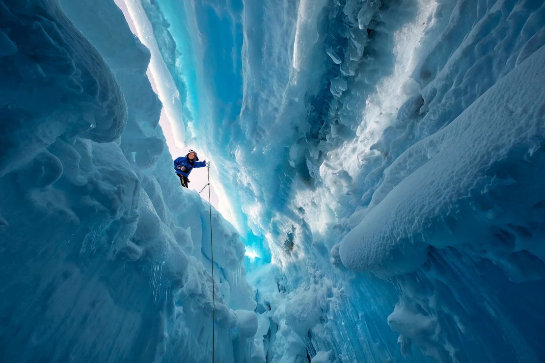 Vivid blue frozen passages create an otherworldly landscape.