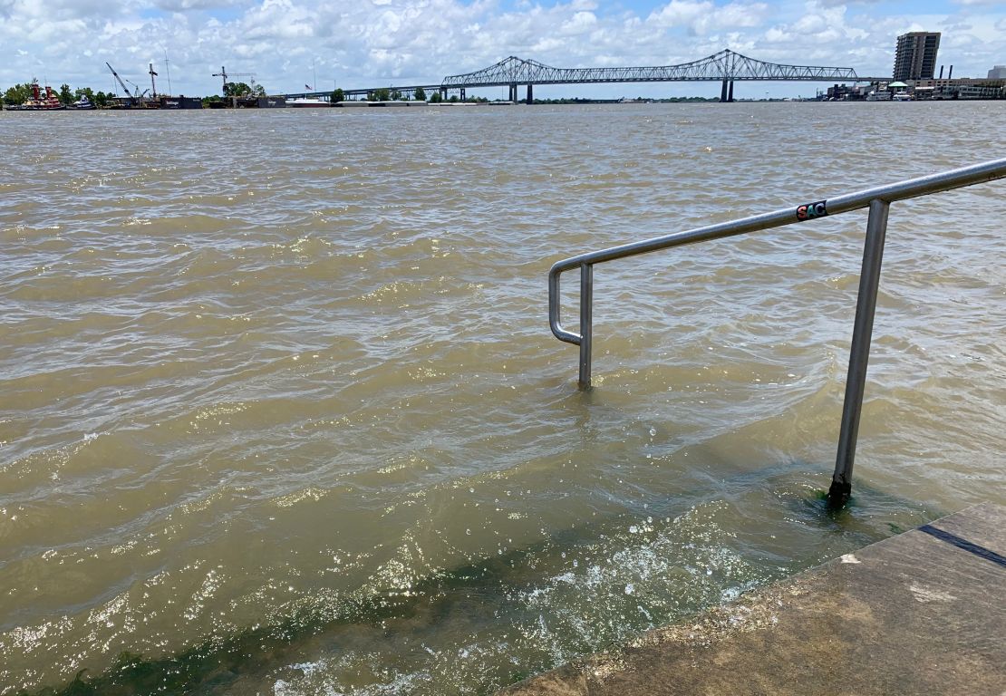 The Mississippi River laps at the stairs on a protective levee on Thursday, July 11, in New Orleans as Tropical Storm Barry approaches.