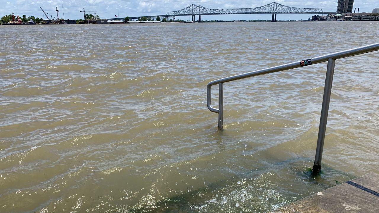 The Mississippi River laps at the stairs on a protective levee on Thursday, July 11, in New Orleans as Tropical Storm Barry approaches.