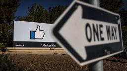 Signage is displayed outside Facebook Inc. headquarters in Menlo Park, California, U.S., on Tuesday, Oct. 30, 2018. Facebook Inc., which had warned of rising costs and slowing growth, reported quarterly revenue roughly in line with expectations and profit that beat analysts' forecasts. And despite scandals around fake news and election interference, it added more users, too. Photographer: David Paul Morris/Bloomberg via Getty Images