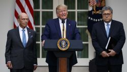 President Donald Trump, joined by Commerce Secretary Wilbur Ross, left, and Attorney General William Barr, speaks during an event about the census in the Rose Garden at the White House in Washington, Thursday, July 11, 2019. (AP Photo/Carolyn Kaster)