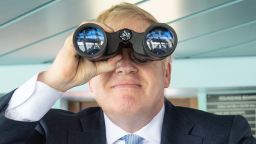  Boris Johnson looks through binoculars on the bridge of the Isle of Wight ferry as it sets sail on June 27, 2019 in Portsmouth, England.