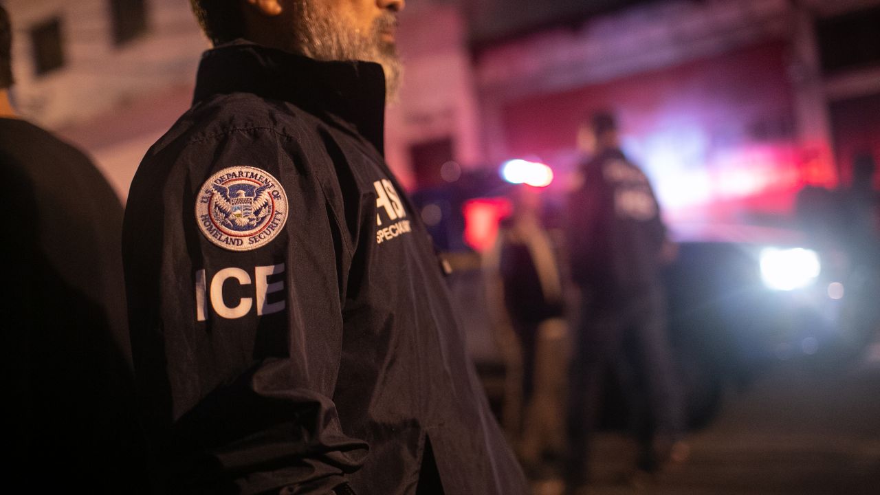 GUATEMALA CITY, GUATEMALA - MAY 29: An ICE agent with U.S. Homeland Security Investigations (HSI), watches as Guatemalan police investigate the scene after detaining a suspected human trafficker on May 29, 2019 in Guatemala City. Homeland Security agents accompanied Guatemalan police on an early morning raid, the first since Acting U.S. Homeland Security Secretary Kevin McAleenan signed an agreement with his Guatemalan counterparts, increasing cooperation on human and drug smuggling. McAleenan is on a four-day trip to Guatemala. (Photo by John Moore/Getty Images)