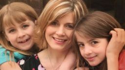 Abby, left, at age nine with her mom and sister.