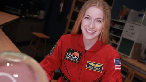 Abby sporting her signature red flight suit.