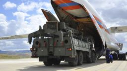 Military vehicles and equipment, parts of the S-400 air defense systems, are unloaded from a Russian transport aircraft, at Murted military airport in Ankara, Turkey, Friday, July 12, 2019. The first shipment of a Russian missile defense system has arrived in Turkey, the Turkish Defense Ministry said Friday, moving the country closer to possible U.S. sanctions and a new standoff with Washington. The U.S. has strongly urged NATO member Turkey to pull back from the deal, warning the country that it will face economic sanctions. (Turkish Defence Ministry via AP, Pool)