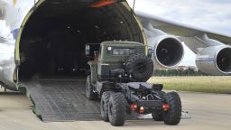 Military vehicles and equipment, parts of the S-400 air defense systems, are unloaded from a Russian transport aircraft, at Murted military airport in Ankara, Turkey, Friday, July 12, 2019. The first shipment of a Russian missile defense system has arrived in Turkey, the Turkish Defense Ministry said Friday, moving the country closer to possible U.S. sanctions and a new standoff with Washington. The U.S. has strongly urged NATO member Turkey to pull back from the deal, warning the country that it will face economic sanctions. (Turkish Defence Ministry via AP, Pool)