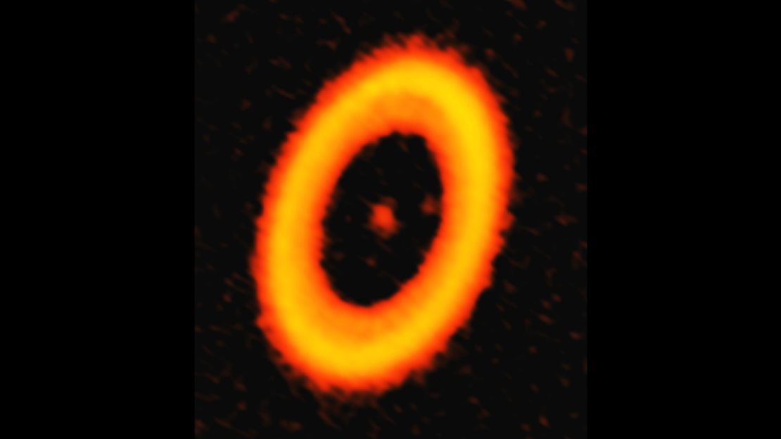This image from ALMA shows dust within the PDS 70 system. The two dots inside the disk are planets.