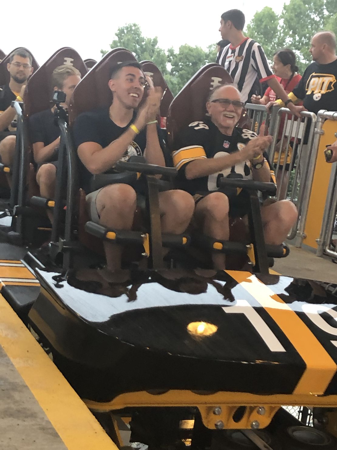 Pittsburgh residents Jack Thompson (right), 67, and his son, Gavin Virag, 28, won a contest to be the first riders on Steel Curtain. This is their reaction at the end of the ride on Friday, July 12, 2019.