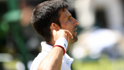 Novak Djokovic reacts after winning a titanic 45-shot rally.