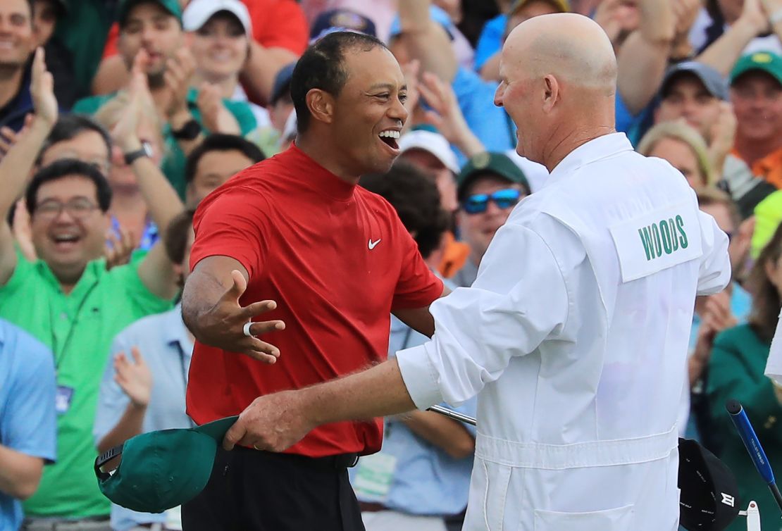 Tiger Woods celebrates with caddie Joe LaCava after winning the 2019 Masters at Augusta.