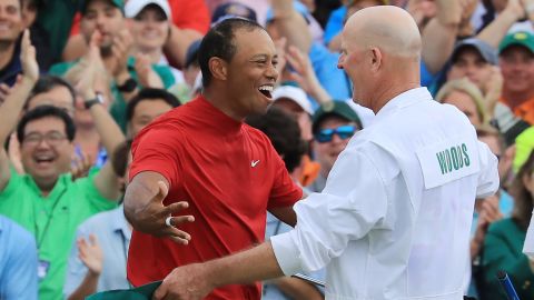 Tiger Woods celebrates with caddie Joe LaCava after winning the 2019 Masters at Augusta.