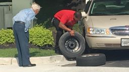 It took Chick-fil-A manager Daryl Howard, right, about 15 minutes to change a flat tire for a 96-year-old WWII veteran they know as "Mr. Lee".