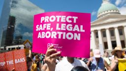 Protesters hold signs as they rally in support of Planned Parenthood and pro-choice and to protest a state decision that would effectively halt abortions by revoking the center's license to perform the procedure, near the Old Courthouse in St. Louis, Missouri, May 30, 2019. (Photo by SAUL LOEB / AFP)        (Photo credit should read SAUL LOEB/AFP/Getty Images)