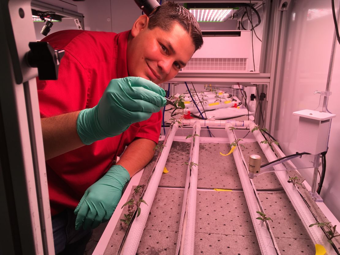 Jacob Torres with a microgravity test bed.
