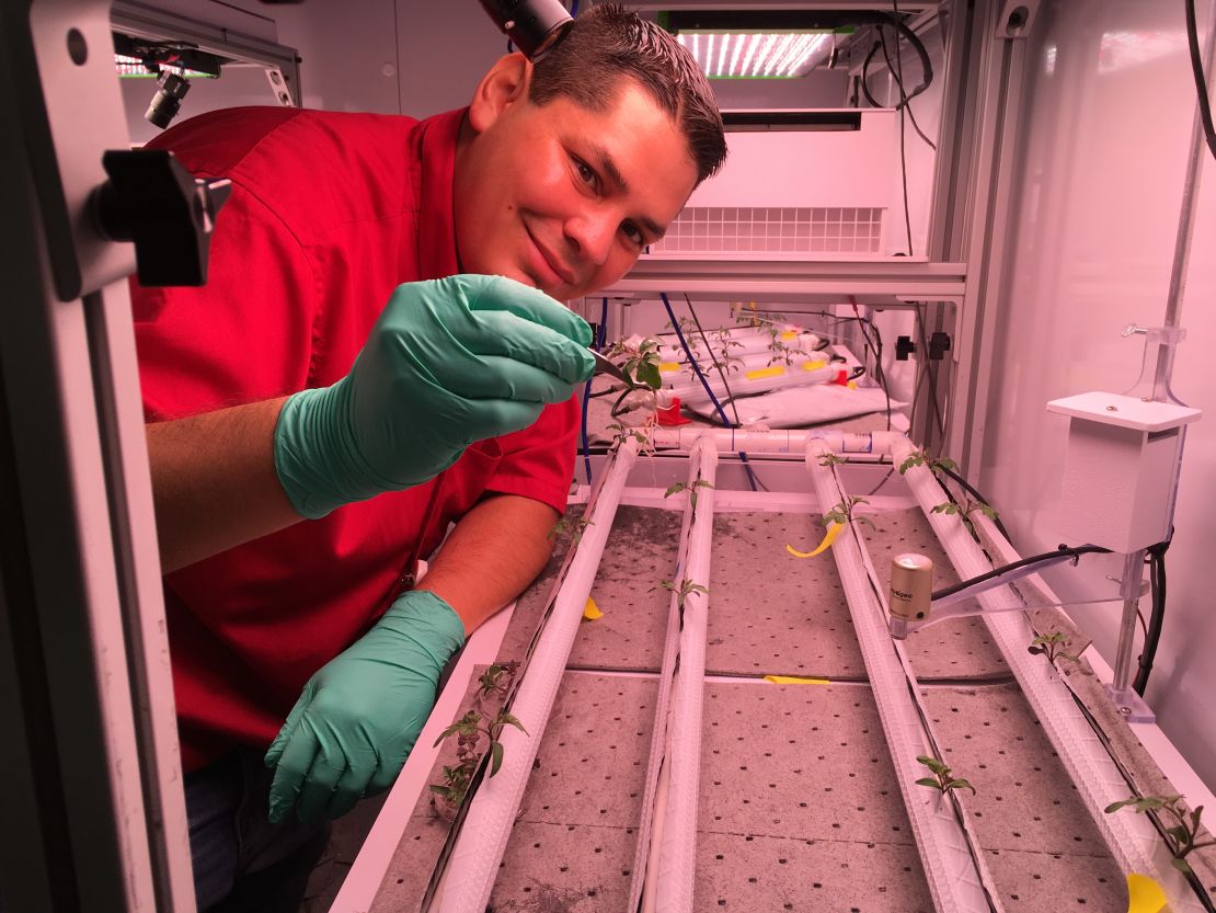 Jacob Torres with a microgravity test bed.