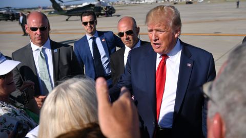 US President Donald Trump greets supporters after stepping off Air Force One upon arrival at Cleveland Hopkins International Airport in Cleveland, Ohio on July 12, 2019. - Trump is in Cleveland, to attend a fundraiser. (Photo by MANDEL NGAN / AFP)        (Photo credit should read MANDEL NGAN/AFP/Getty Images)