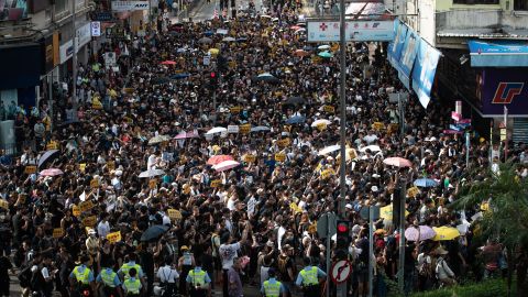 Hong Kong police called for demonstrators to "leave peacefully" after scuffles developed between protesters and police.