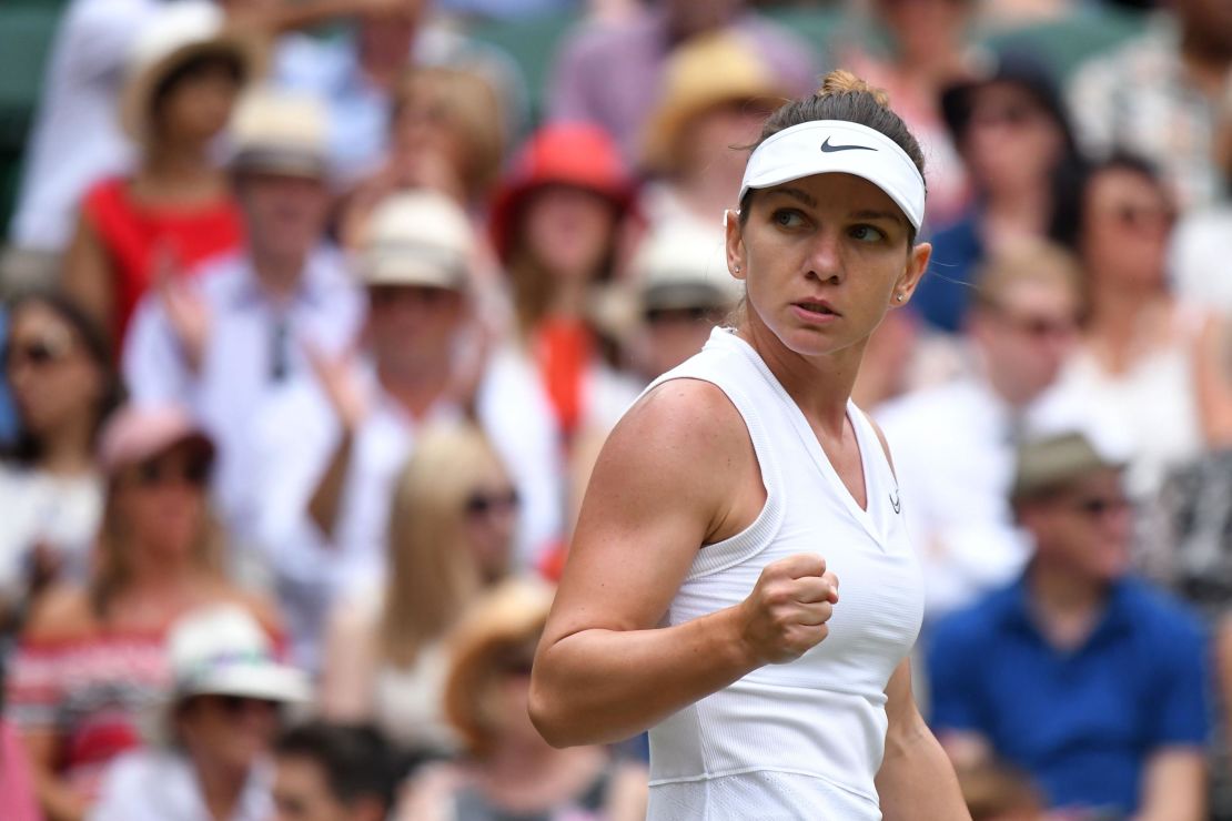Romania's Simona Halep gives a fist pump after winning a point on the way to taking the opening set against Serena Williams in the women's singles final at Wimbledon. 