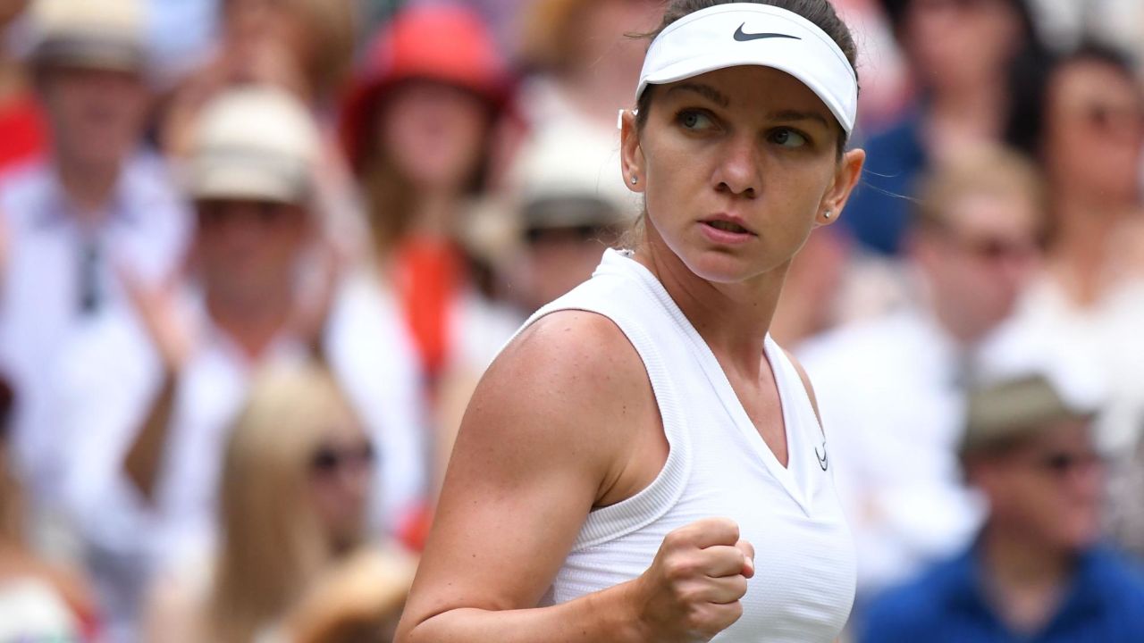 Romania's Simona Halep gives a fist pump after winning a point on the way to taking the opening set against Serena Williams in the women's singles final at Wimbledon.