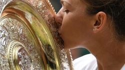 Romania's Simona Halep kisses the Venus Rosewater Dish trophy after beating Serena Williams in the Wimbledon women's singles final.