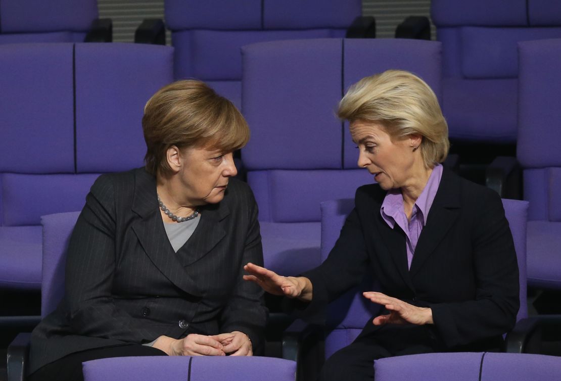 Angela Merkel and von der Leyen, then defense minister, talk ahead of a 2015 vote on military action against ISIS in Syria. 