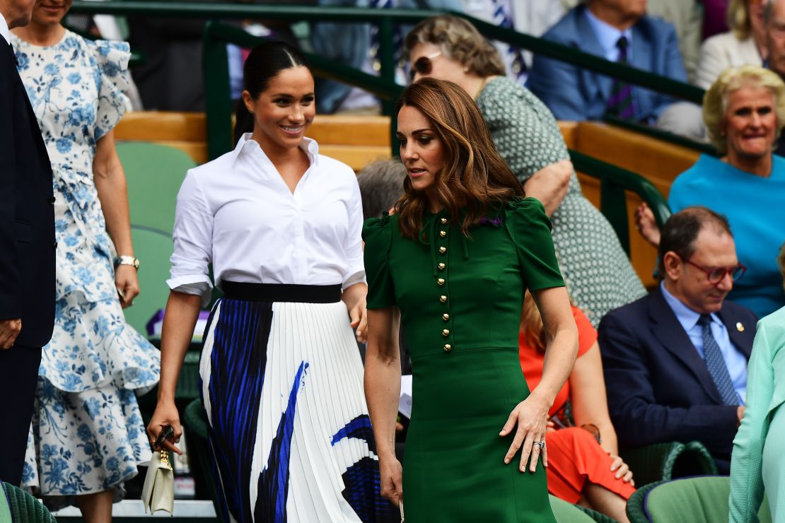 Catherine and Meghan enter the Royal Box for the women's singles final on Saturday.