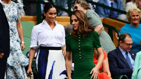Catherine and Meghan enter the Royal Box for the women's singles final on Saturday.