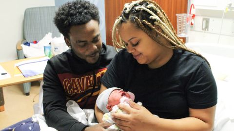 Proud parents Johntez Brown and Rachel Langford holding newborn baby J'Aime Brown.