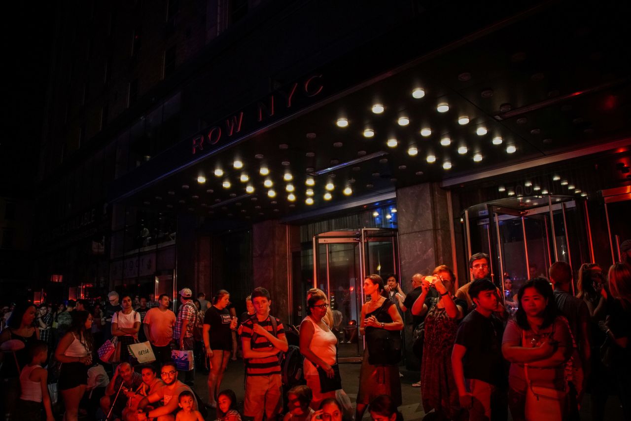 People are evacuated outside Row NYC hotel.