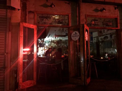 People sit inside a bar during the power outage.