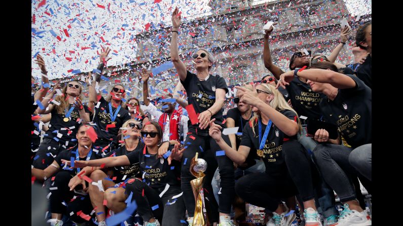 The US women's national soccer team celebrates their World Cup win at City Hall in New York after a ticker tape parade on Wednesday, July 10.