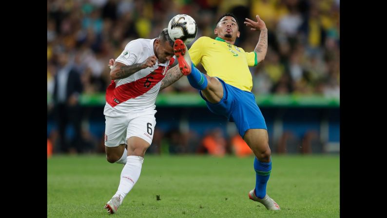Brazil's Gabriel Jesus fights for the ball with Peru's Miguel Angel Trauco during the final match of the Copa America in Rio de Janeiro, Brazil, on Sunday, July 7.
