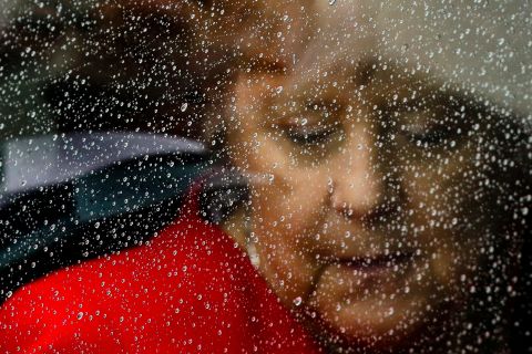 Raindrops cover the window of a car as Merkel arrives for the opening of the James-Simon-Galerie in Berlin in July 2019.