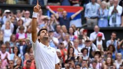 Serbia's Novak Djokovic celebrates beating Switzerland's Roger Federer during their men's singles final on day thirteen of the 2019 Wimbledon Championships at The All England Lawn Tennis Club in Wimbledon, southwest London, on July 14, 2019. (Photo by Ben STANSALL / AFP) / RESTRICTED TO EDITORIAL USE        (Photo credit should read BEN STANSALL/AFP/Getty Images)