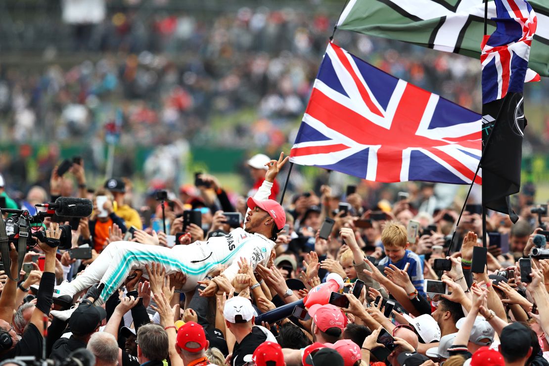 Lewis Hamilton crowd surfed with his adoring fans following his win at Silverstone.