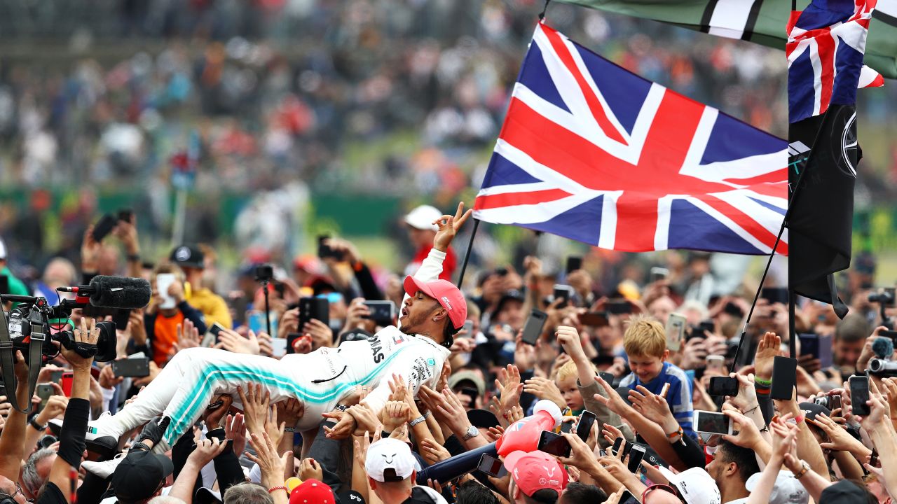 Lewis Hamilton crowd surfed with his adoring fans following his win at Silverstone.