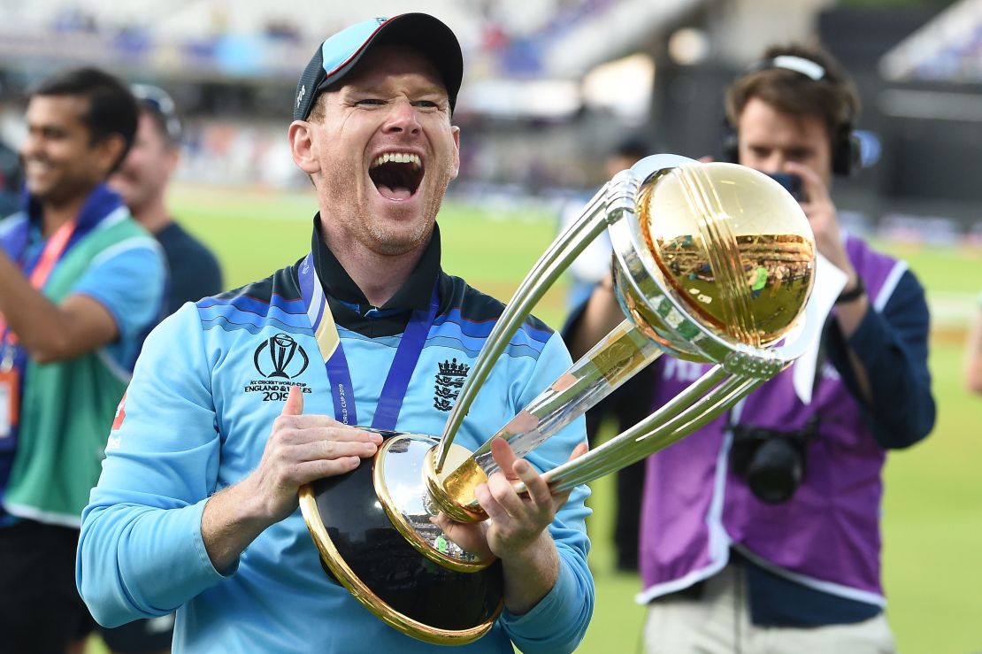 England's captain Eoin Morgan celebrates with the World Cup trophy.