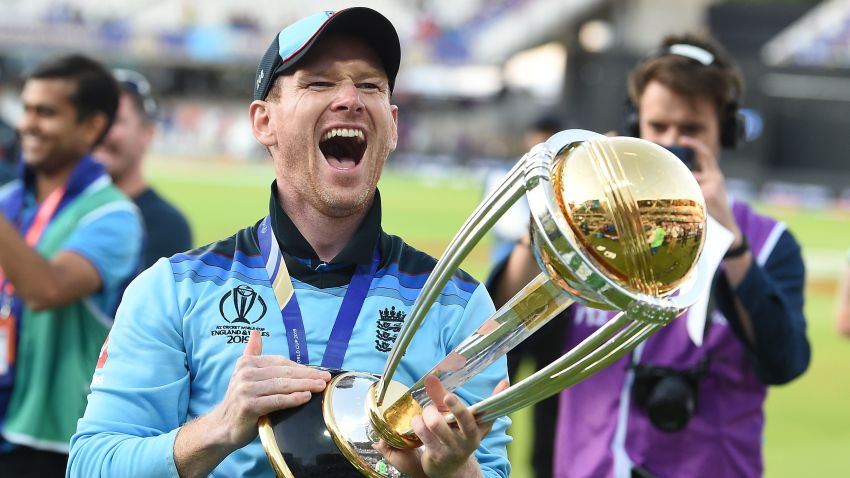 England's captain Eoin Morgan celebrates with the World Cup trophy on the pitch after the 2019 Cricket World Cup final between England and New Zealand at Lord's Cricket Ground in London on July 14, 2019. - England won the World Cup for the first time as they beat New Zealand in a Super Over after a nerve-shredding final ended in a tie at Lord's on Sunday. (Photo by Paul ELLIS / AFP) / RESTRICTED TO EDITORIAL USE        (Photo credit should read PAUL ELLIS/AFP/Getty Images)